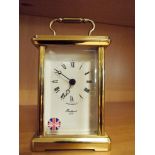 Modern brass cased carriage style clock