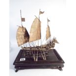 19th century Chinese silver model of a junk on a carved hardwood base,