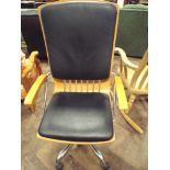 Excellent revolving chrome framed executives office elbow chair with highly polished wood frame and