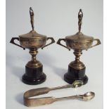 Pair of hallmarked silver twin handled swimming trophies on turned bakelite bases,