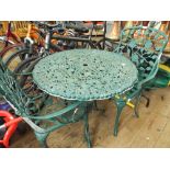 A green painted metal garden circular table with 2 matching chairs