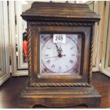 An antique style quartz mantle clock fitted with interior secret drawers