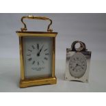 A brass cased carriage clock by Camerer Kuss & Co London and another miniature carriage clock by