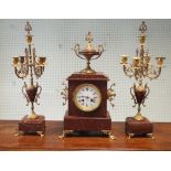 French 3 piece rouge marble and gilt mounted clock garniture comprising striking clock and a pair