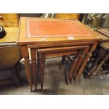 A nest of 3 reproduction mahogany coffee tables with red leather tops (glass tops missing)