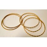 Five middle eastern gold bangles tests as high carat gold approx 41gms