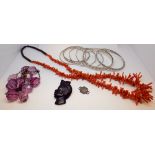 Nine silver bangles, dress ring, stick coral necklace and other items.