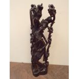 Large Indonesian carved hardwood figure of a couple embracing 82 cms tall