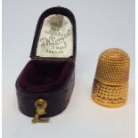 A 9ct yellow gold thimble in fitted case by Long and Co Cardiff gross weight 6gms