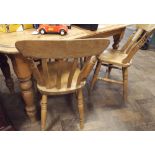 5' stripped pine kitchen or dining table on turned legs and four similar slat back windsor dining