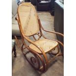 A cane panelled Bentwood rocking chair