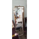 Three long gilt framed mirrors