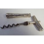 Georgian silver corkscrew in cylindrical ribbed container,