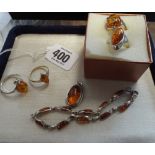 Four silver and Baltic amber ladies dress rings,