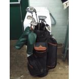 A quantity of golf clubs in a golf bag