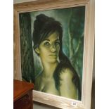 Framed picture of a young lady in limed oak style frame by GH Lynch
