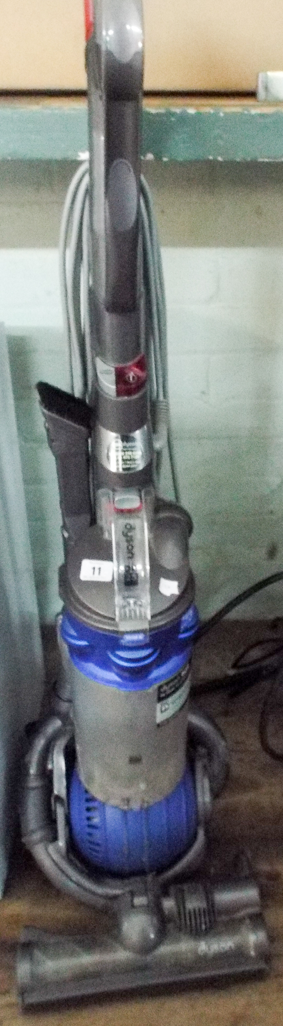 Blue and silver Dyson upright vacuum cleaner