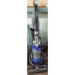 Blue and silver Dyson upright vacuum cleaner