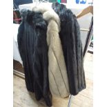 Three simulated fur coats