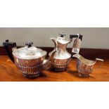 Harlequin silver tea service of half-lobed form,