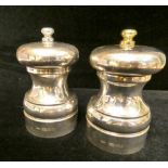 Pair of modern silver cased salt and pepper mills,