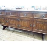 74" long sideboard with four drawers and four linen fold panel cupboard door