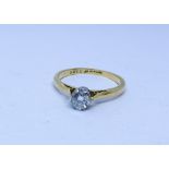 Single stone diamond ring on an 18ct gold and platinum setting ring size P