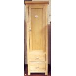 Tall narrow heavy light oak cabinet with drawers under,