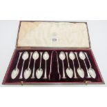 Cased set of 12 teaspoons and matching sugar nips,