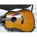 1970's acoustic six string sigma guitar in its black fitted case Model number 94070616