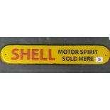 A large Shell Oil sign