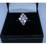 18ct white gold diamond cluster ring set 9 diamonds in a diamond shaped panel,