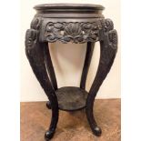 Two tier circular ebonised Chinese carved plant pedestal 14" diameter