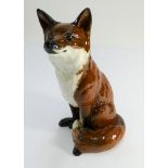 A Beswick fireside model of a seated fox numbered on base 2348 height 33cms