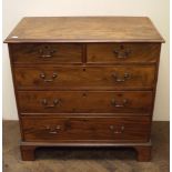 Georgian mahogany chest of three long and two short drawers standing on bracket feet with metal