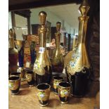 Three Bohemian gilt and enamelled decanters and goblet sets