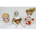 A group of three 19th century pin cushion half dolls,