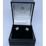 Pair of 18ct white gold diamond set ear studs in a modern square setting
