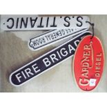 Four assorted cast iron signs Fire Brigade, SS Titanic, Gardener Diesel,