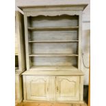 Shabby chic cream painted pine bookcase/shop fitting, open shelf top standing on cupboard base.