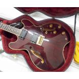 Daion six string burgundy colour electric guitar, model Headhunter 555,