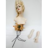 A French plaster half doll with a blonde up do, bust modelled on back JDA,