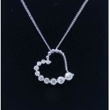 Pretty modern open heart shaped diamond set pendant,