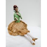 Art Deco porcelain pin cushion half doll wearing a green high necked blouse approx 20cms tall