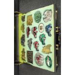 Case of 18 assorted American car and other motif belt buckles by Bergamont Brass Works, Tanside,