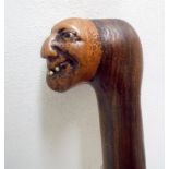 Walking cane with carved head handle possibly Fagin