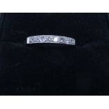 Older style platinum mounted diamond eternity half hoop ring,