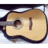 Ridgefield six string acoustic guitar with strap in its black hard fitted case