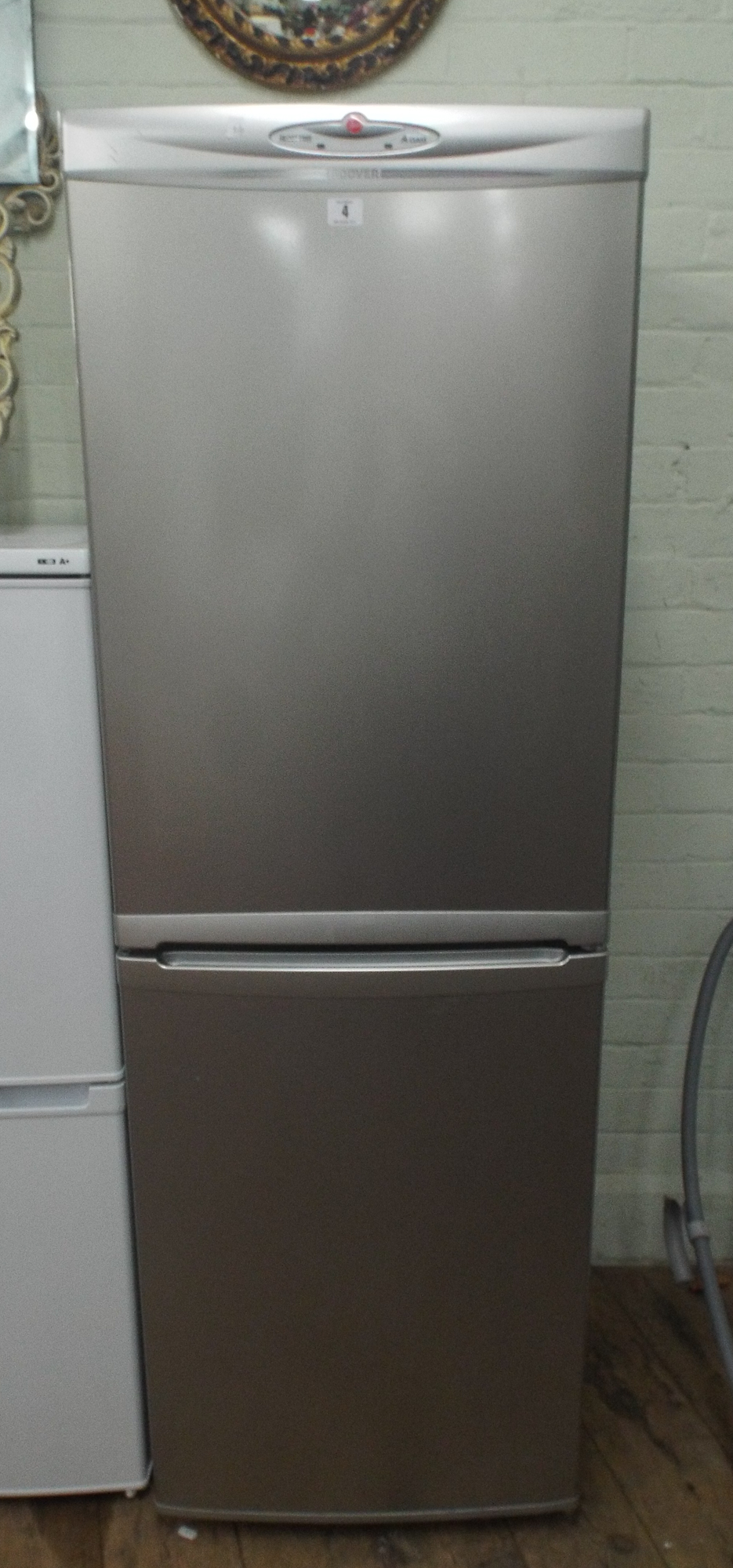 Hoover half and half fridge freezer in a silver case