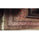 A pink and patterned Persian style rug about 6'6 x 3'3